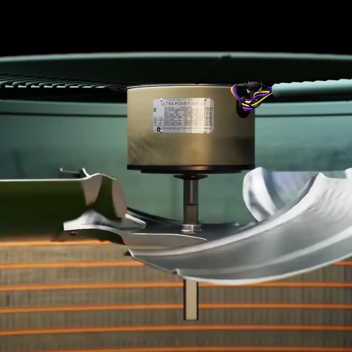 Cutaway view of an hvac condenser fan motor and blade assembly in motion